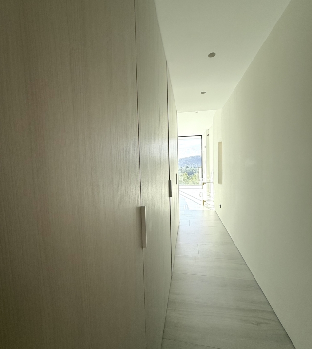 Resa Estates Can Furnet Ibiza te koop sale modern villa sea dalt villa views hallway bedroom.jpeg